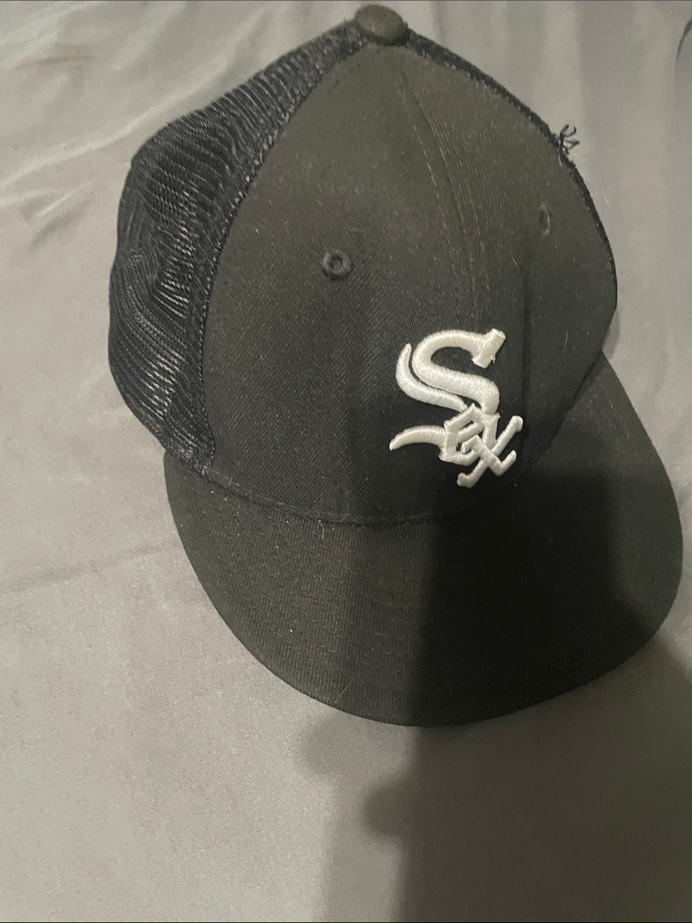 New Era Black Trucker Hat with White Sox Logo
